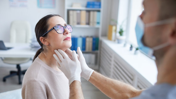 Caring medical doctor consulting girl in office with stethoscope checking breath. Specialist in medicine providing health care service consultation diagnostic examination treatment in hospital cabinet